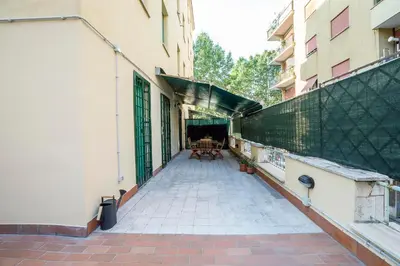a balcony of a building with a table and chairs at JHHIT Tuscolana Suite 03 with Terrace in Rome