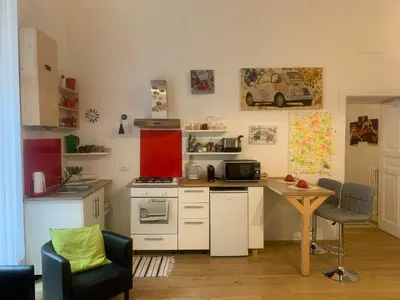a kitchen with a counter and a table in a room at La 