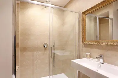 a bathroom with a shower and a sink at Daplace - Gaia Apartment in Rome