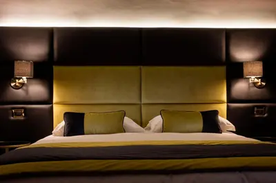 a bedroom with a large bed with two pillows at Mi Hotel Home in Rome