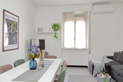 a living room with a white table and a couch at Triumph Apartment in Rome