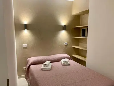 a bedroom with two towels on a bed at Chroma Apt Farinone 28 in Rome
