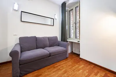 a brown door on the side of a building at Art House Centro Storico Apartment in Rome