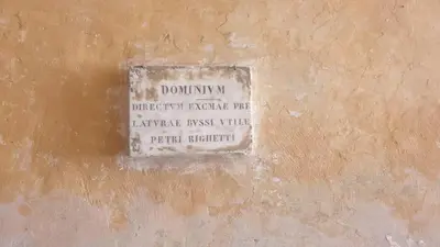 a sign on the side of a wall at Magenta Luxury Argentina in Rome