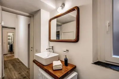 a bathroom with a sink and a mirror at Farnese House in Rome in Rome