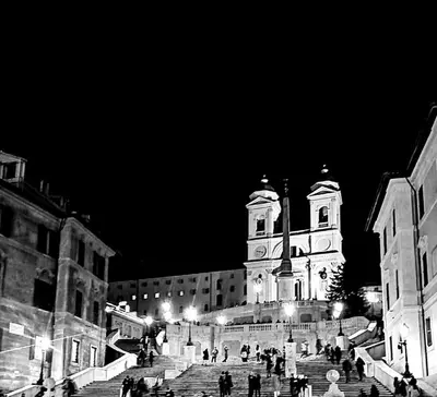 a black and white photo of a building with a clock tower at My Trevi Rooms 88 in Rome