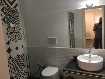 a bathroom with a sink and a toilet and a mirror at Ale 160 in Rome