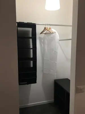 a bathroom with black and white towels on a rack at Ale 160 in Rome