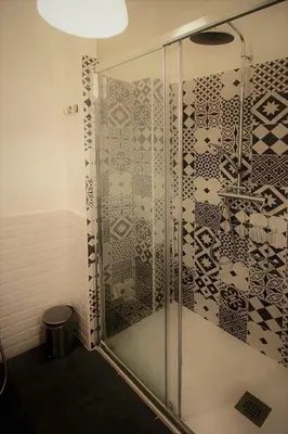 a bathroom with a shower with a glass door at Ale 160 in Rome