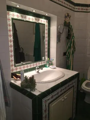 a bathroom with a sink and a mirror at Elle house Roma in Rome