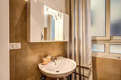 a bathroom with a sink and a mirror at Guest House o Affittacamere La Civetta di Trastevere B in Rome