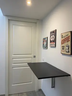 a white door with a black counter in a room at Delizioso Appartamento in Via di Monte Verde in Rome