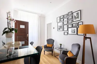 a living room with a glass table and two chairs at Residenza Palline by Hili in Rome