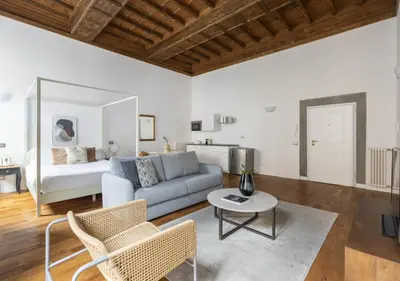 a living room with a couch and a table at Residenza Palline by Hili in Rome