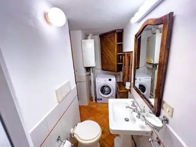 a bed with pillows and towels on it in a room at Spanish Steps Terrace Loft IREX Apartment in Rome