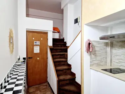 a stairway leading up to a room with a stair case at Lofts In Rome in Rome