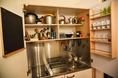 a kitchen with a stainless steel sink in a cabinet at Stylish apartment in central Rome 