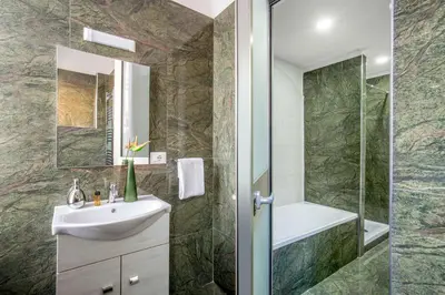 a bathroom with a sink and a shower at Well Done Montebello in Rome