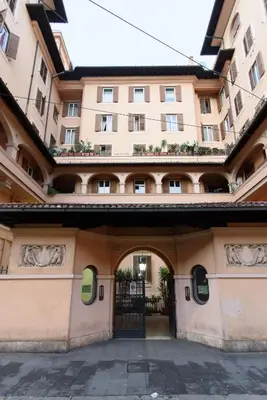 an entrance to a building with a gate at White Napoleone Apartment in Rome