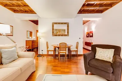 a living room with a couch and a table at Diana-Spanish Steps House in Rome