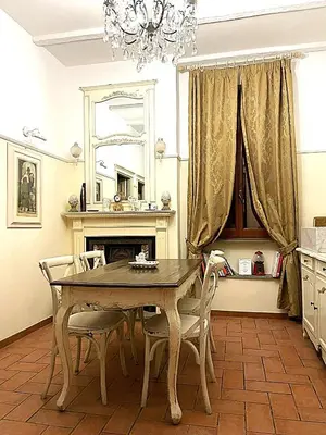 a dining room with a table and chairs and a mirror at Bed and Breakfast 30 in Rome