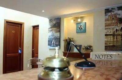 a hotel room with a telephone on a desk at Nights In Rome in Rome