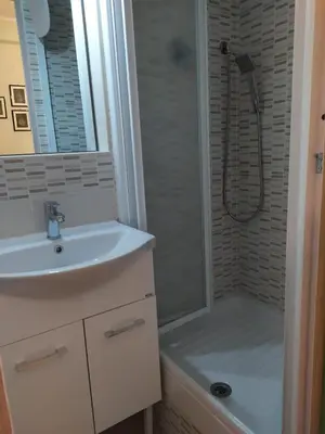 a bathroom with a white sink and a shower at roma capoccia b&b in Rome