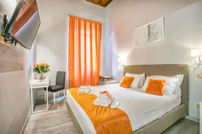 a hotel room with a bed with towels on it at History Suite in Rome