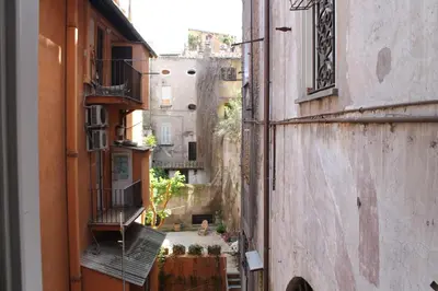 a view of an alley between two buildings at Relais Palazzo Taverna in Rome