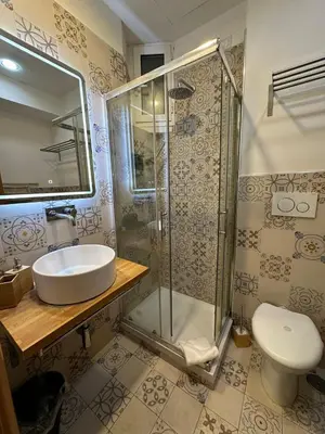 a bathroom with a sink and a shower at Double B in Rome