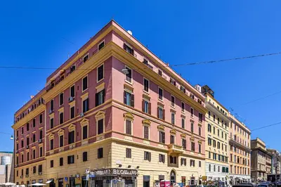 a large building on the corner of a street at Lovely 5 min walk to Saint Peter Basilica in Rome