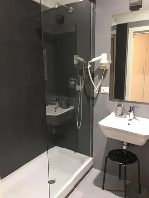 a bathroom with a shower and a sink at Le Vie del Vaticano in Rome