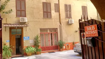 a building with a bar music sign in front of it at B&B Missi in Rome