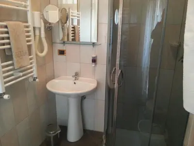 a bathroom with a sink and a shower at B&B Missi in Rome