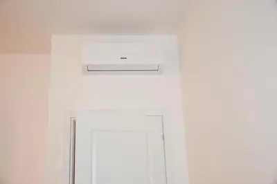 a white door with a sign on top of it at Terrazza San Giovanni apartment in Rome