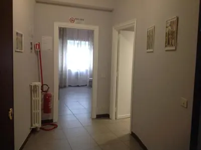 a hallway with a door leading to a room at A casa di Armando in Rome