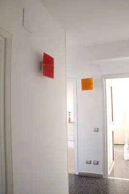 a room with red and orange squares on the wall at Affittacamere Nansen in Rome