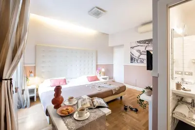 a bedroom with a bed and a table with food on it at Rome River Inn in Rome
