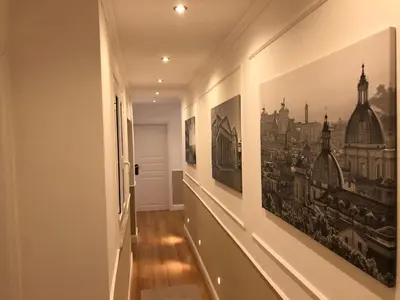 a hallway with two pictures on the walls at Pantheon Luxury Suite in Rome