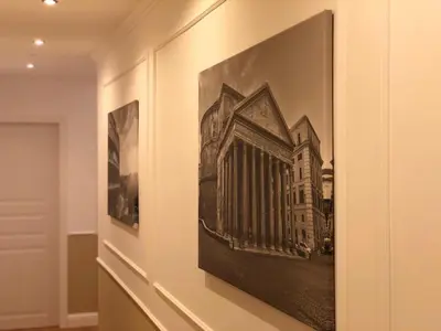 a framed picture of a building on a wall at Pantheon Luxury Suite in Rome