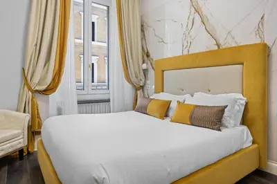 a bedroom with a bed and a window at GHR Navona Inn in Rome