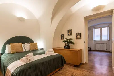 a bedroom with a bed with towels on it at Lovely New Home, Via Nazionale in Rome