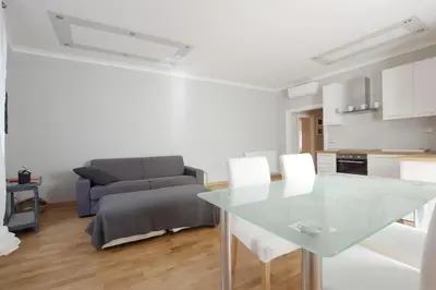 a living room with a glass table and a couch at San Peter Apartment - your home in the heart of Rome in Rome