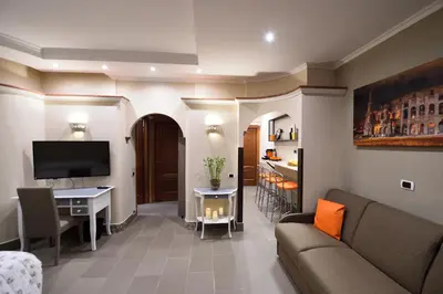 a living room with a couch and a table at Domus Catone in Rome