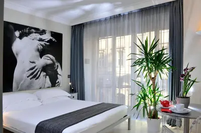 a bedroom with a bed and a large window at B&B Best Pantheon in Rome