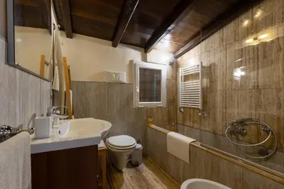 a bathroom with a sink and a toilet and a shower at Colosseum private terrace in Rome