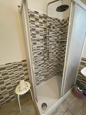 a bathroom with a shower and a sink at Trastevere Sweet Rest in Rome