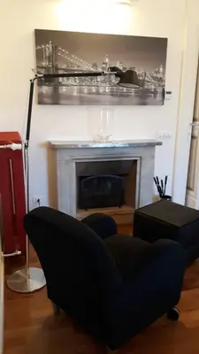 a living room with a couch and a fireplace at Luxury on the River in Rome