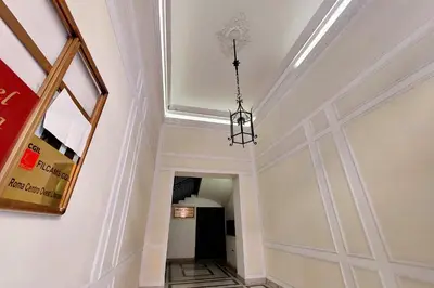a hallway with a ceiling and a chandelier at Sanctuary Home in Rome