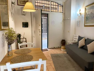 a living room with a couch and a table at Karma House Deluxe Navona in Rome